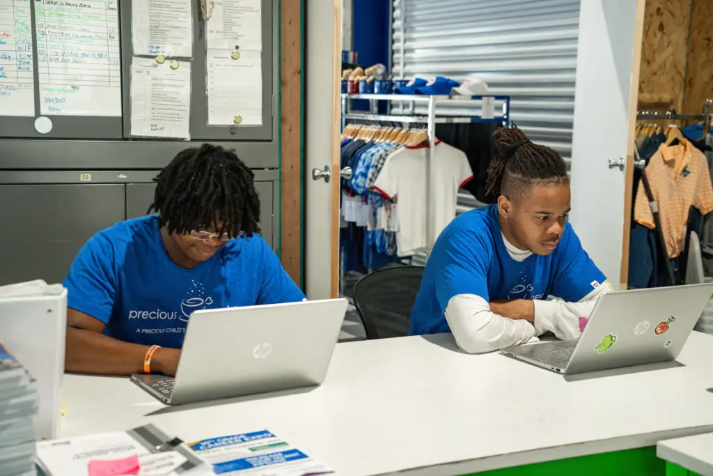 Two young men taking a Precious Pathways course together.