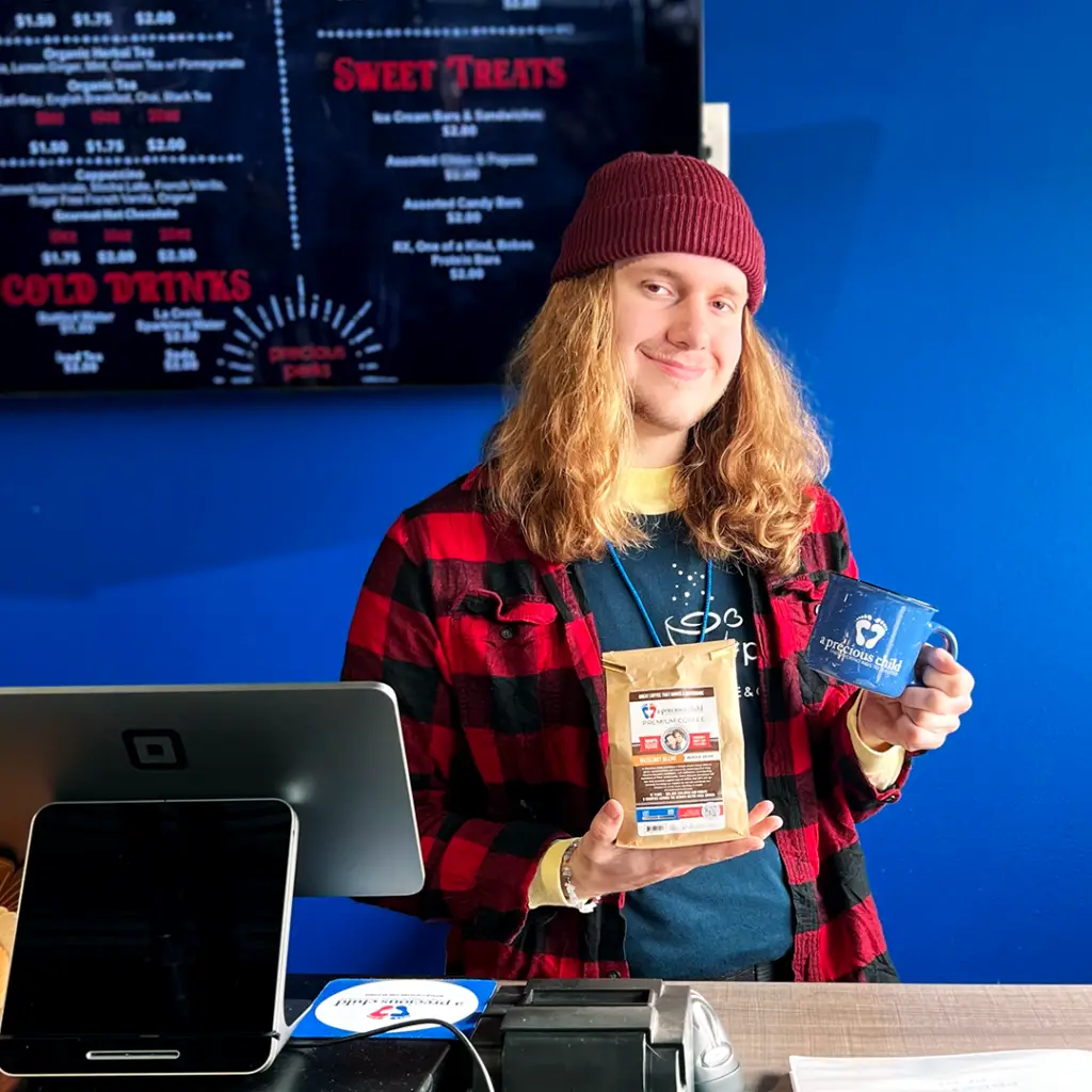 A Pathways participant smiling at their part time job.