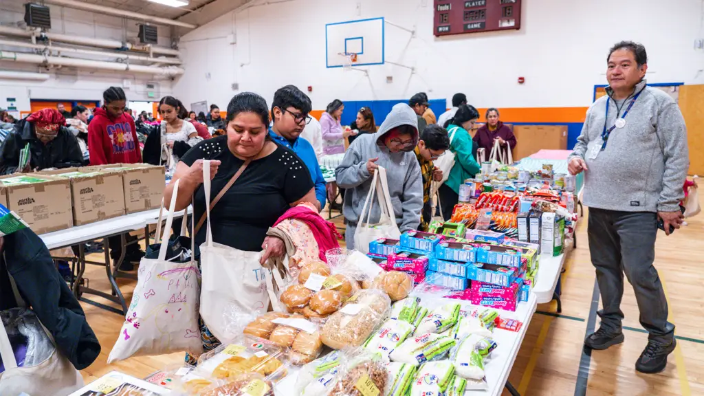 Community members collecting basic need items at a A Precious Child community distribution event