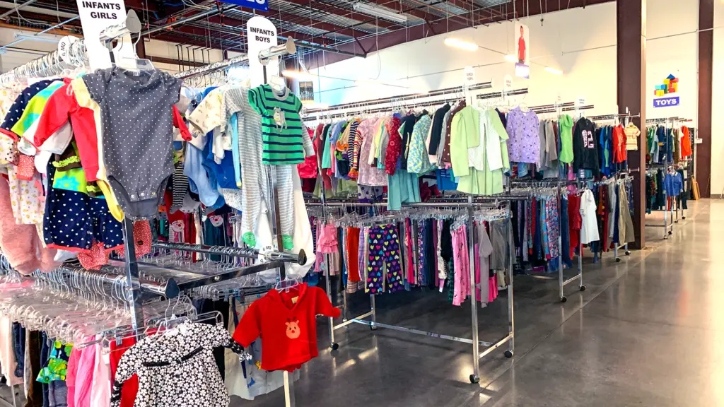 Racks of children's clothing in the A Precious Child Resource Center